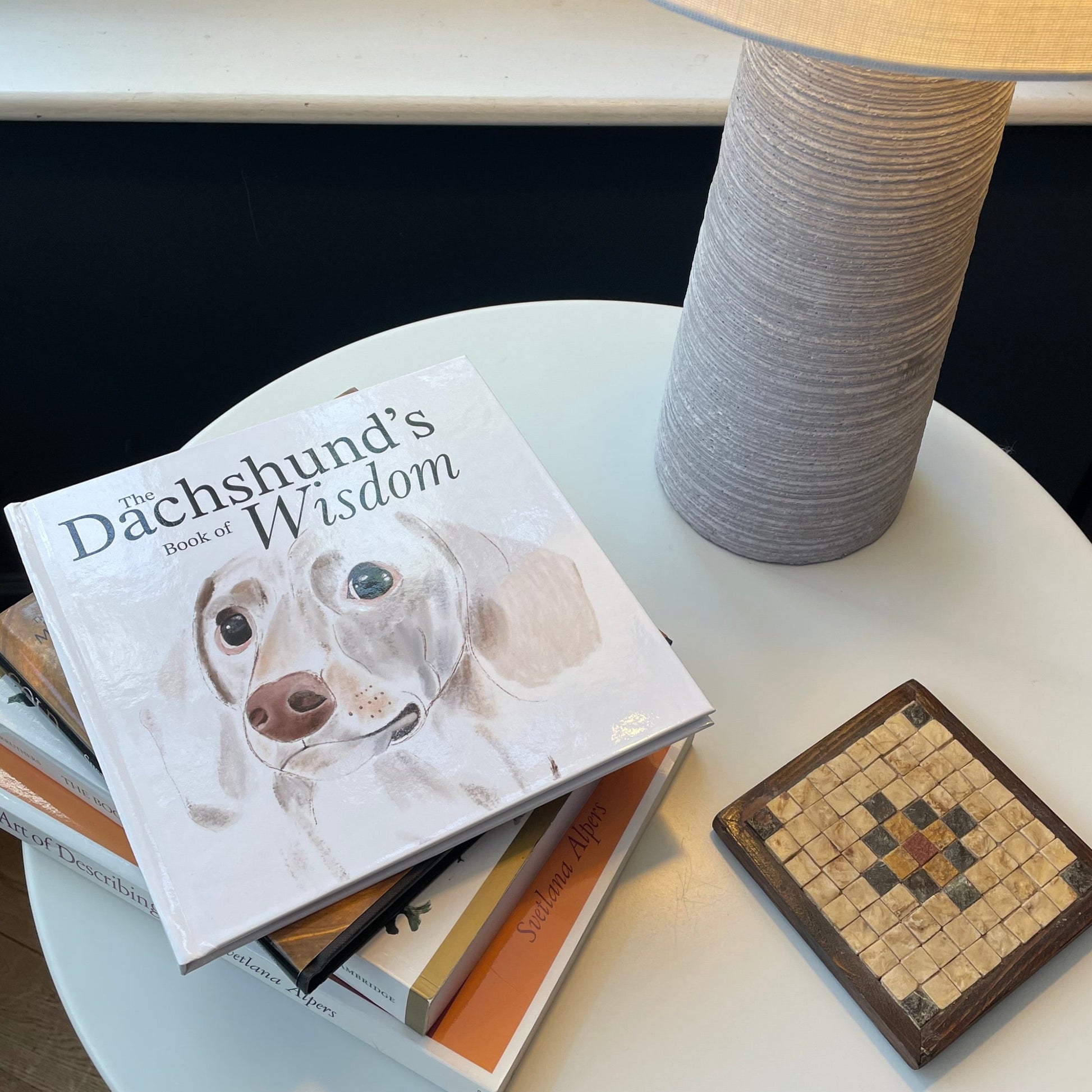 The Dachshund's Book of Wisdom on a Coffee Table | Snow Fox Arts